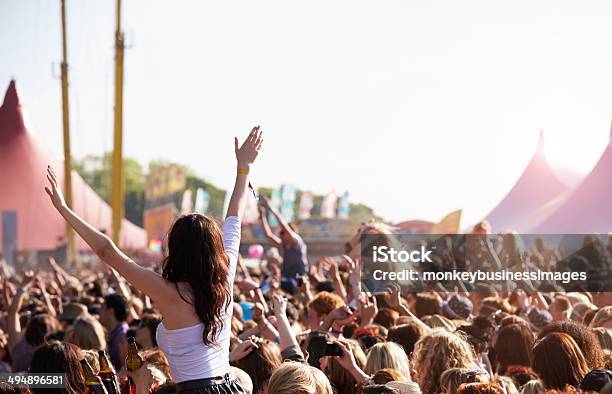 People With Their Arms In Air At Music Festival Stock Photo - Download Image Now - Music Festival, Crowd of People, Outdoors