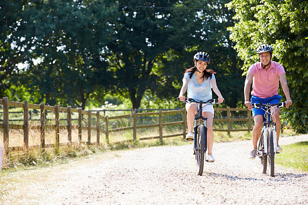istock Asian Couple On Cycle Ride In Countryside 494896701