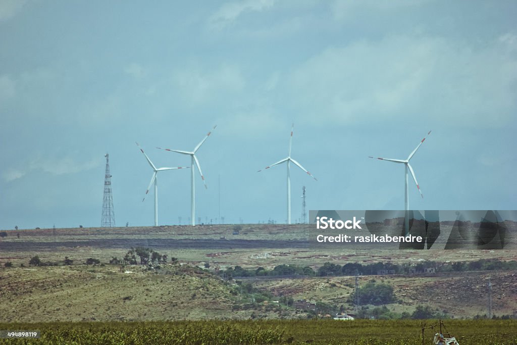 Wind farm and electrical substation Wind farm for electric power production and electrical substation. Agricultural Field Stock Photo