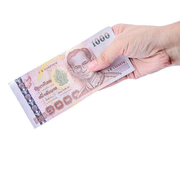 istock Hand holding Thai money isolated on white. 494898291