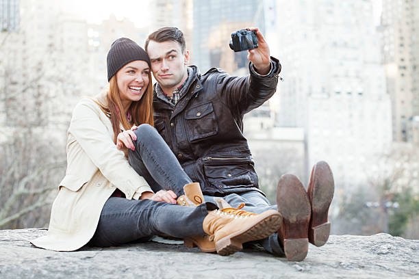 istock Young couple taking a funny selfie outdoors 494900012
