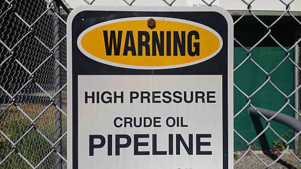 istock Crude oil pipeline warning sign 494900394