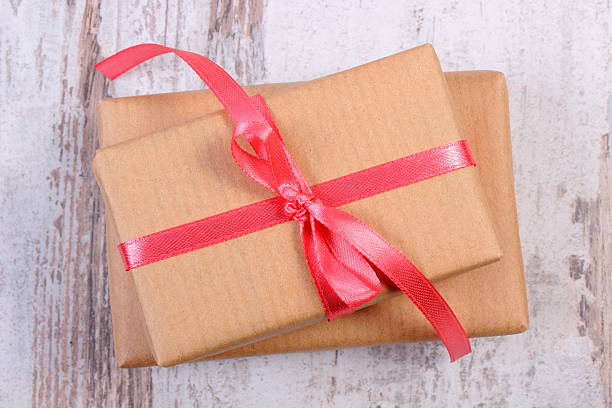 istock Wrapped gifts for Valentines day on old wooden table 494905914
