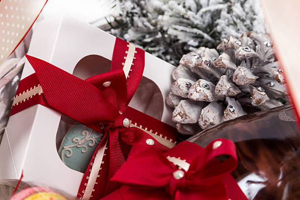 istock christmas present in basket with  pastry, wine, decor 494912498