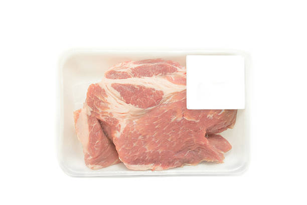 istock Raw pork  in packaging tray with price tag 494914872