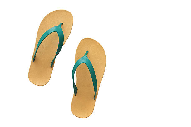 istock yellow and green slippers isolated on white background. 494923544