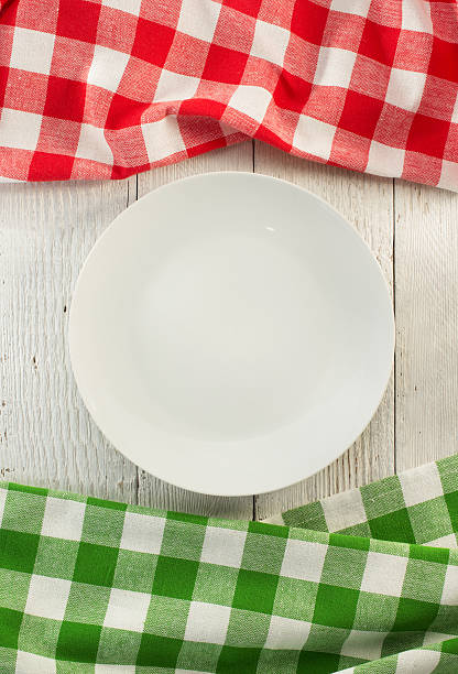 istock cloth napkin and plate on wood 494925908