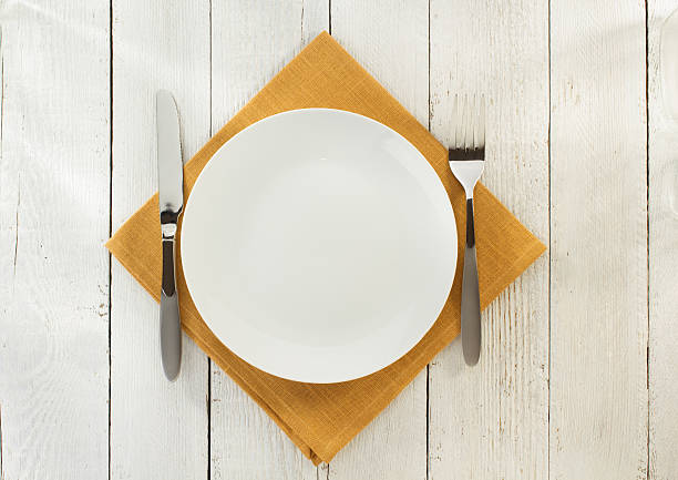 istock cloth napkin and plate on wood 494926378
