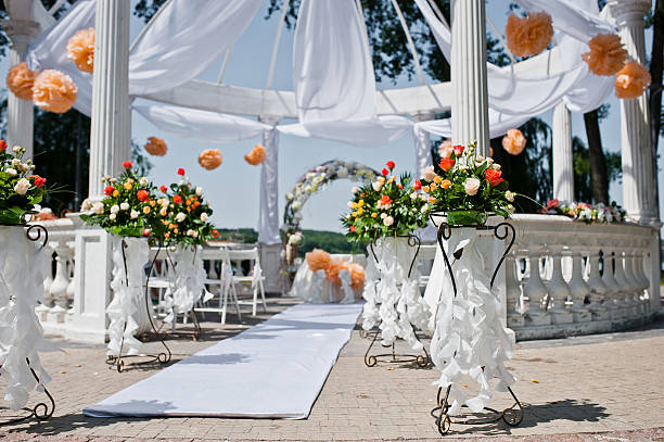 istock wedding arch with chairs and many flowers and decor 494927058
