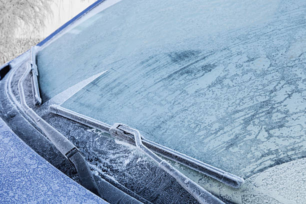 Frozen front windshield of car Frozen front windshield of car during winter morning windshield wiper snow stock pictures, royalty-free photos & images