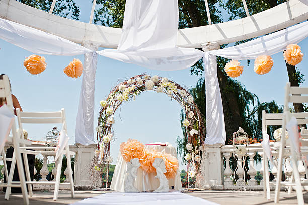 istock wedding arch with chairs and many flowers and decor 494928356