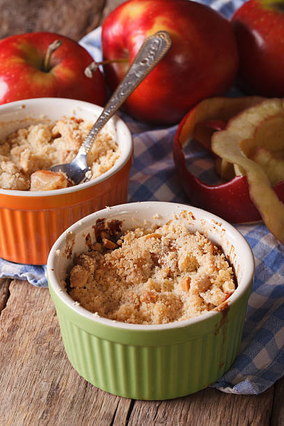 istock English crumble with apples close-up in the pot. Vertical 494928598