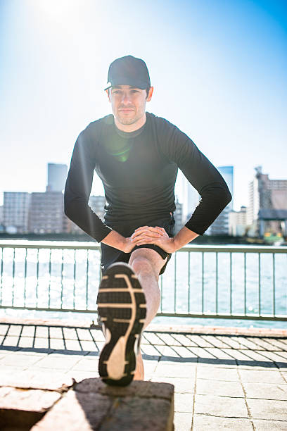 istock man doing stretching on the city 494928822