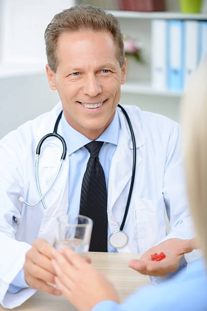istock Professional doctor giving pills 494928924