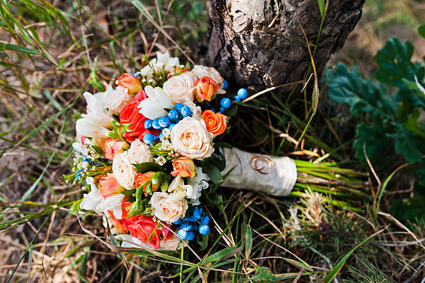 istock wedding bouquet with rings at pine forest 494929060