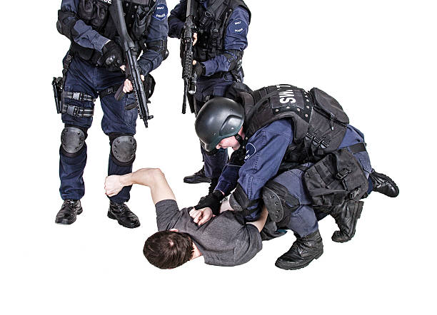 Detention Special weapons and tactics SWAT team makes a bust wrongdoer stock pictures, royalty-free photos & images