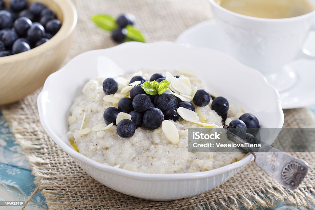 Barley porridge in a bowl Porridge in a bowl with berries, and coffee Barley Stock Photo