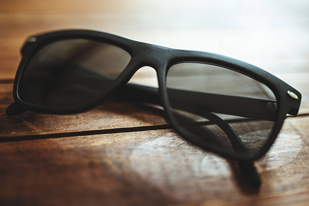 istock sunglasses on plank wood 494933585