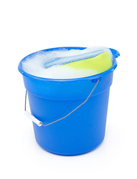Bucket and Sponge Blue bucket with soapy water and a sponge. Isolated on white. bucket and sponge stock pictures, royalty-free photos & images