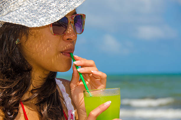 istock Woman relaxing and drinking Cocktail 494934871