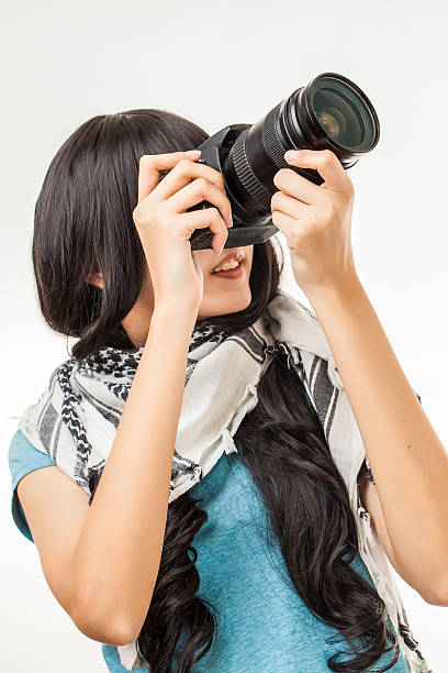 istock asian woman and camera 494936381