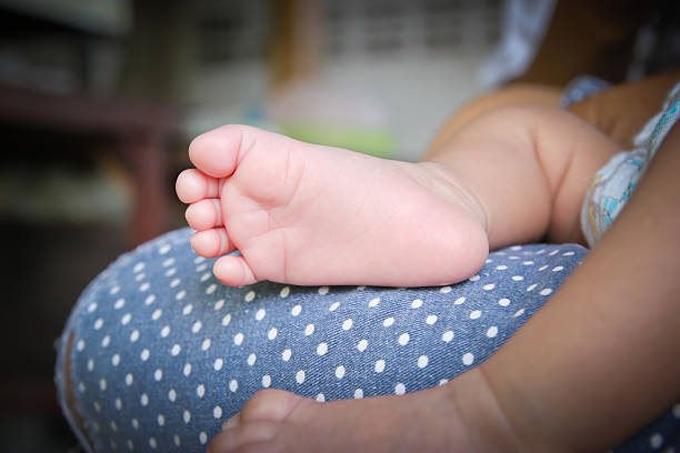 A close-up of newborn baby feet