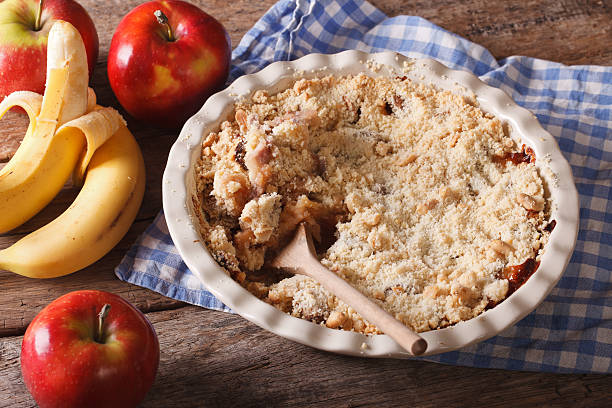 istock Crumble with apple and banana close-up, horizontal, rustic 494937844