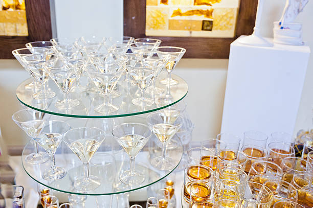 istock glasses of drinks on circle mirrors on wedding reception 494938938