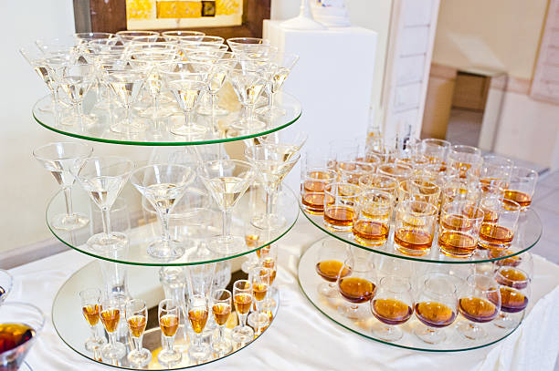 istock glasses of drinks on circle mirrors on wedding reception 494938982