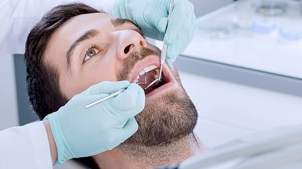 istock Young man at the dentist 494939104