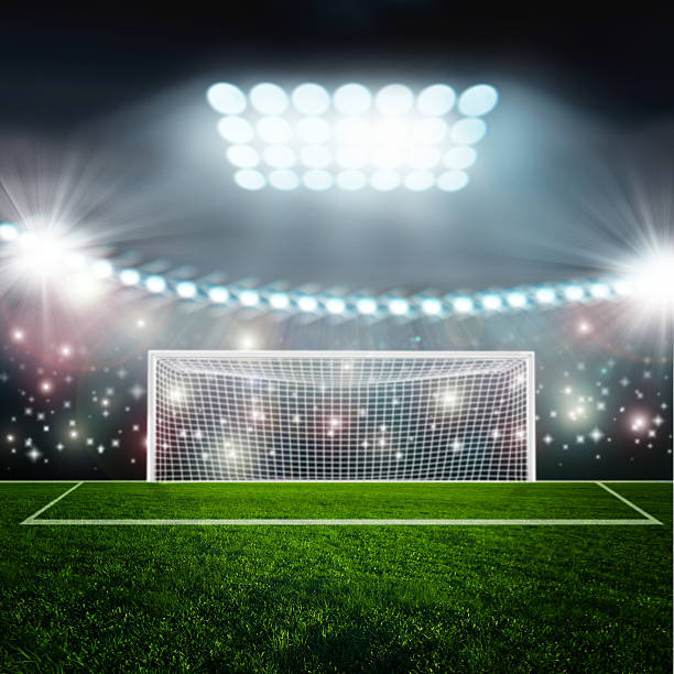 istock Soccer ball on green stadium arena 494939145
