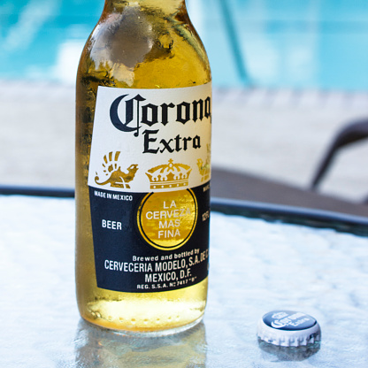 Austin, TX, USA - July 06, 2014: Corona Extra is a pale lager produced by Cervecería Modelo in Mexico for domestic distribution and export to all other countries.