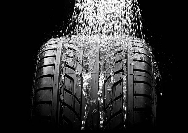 istock New tire with water running down its length 494955305