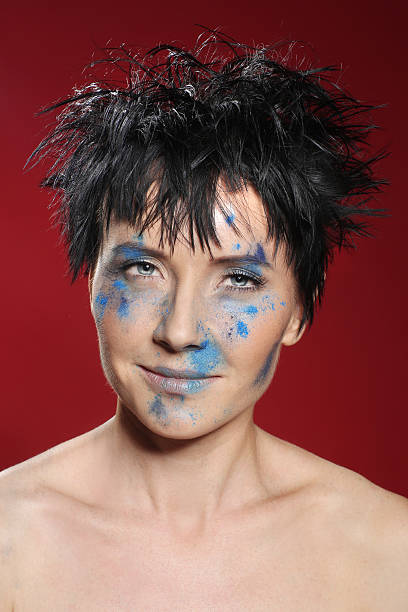istock Holi Powder Face Painted Woman 494957375