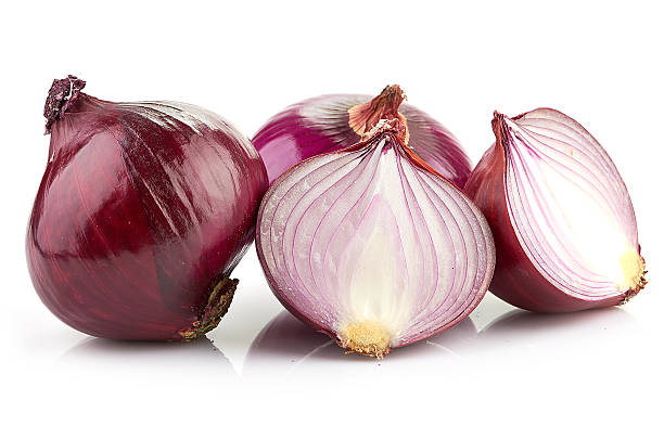 istock Red sliced onion isolated on white background 494957801
