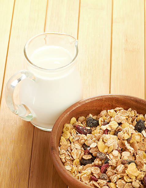 istock Plate with raw oatmeal on wooden table. 494957859