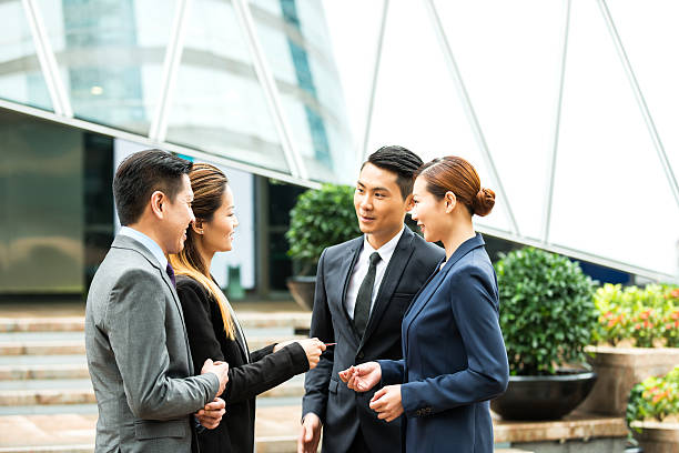 Asian Business Team Exchanging Business Card