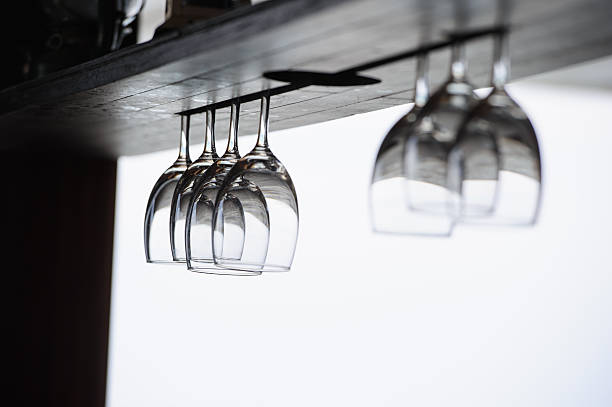 istock glasses hang up side down in the beach front 494958675