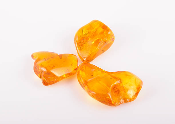 istock amber gemstone on white. Soft focus, photo toned 494958990