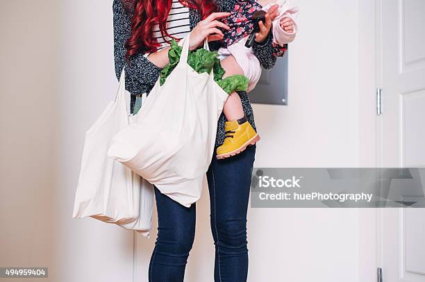 Carrying Groceries In Stock Photo - Download Image Now - Mother, Groceries, Carrying