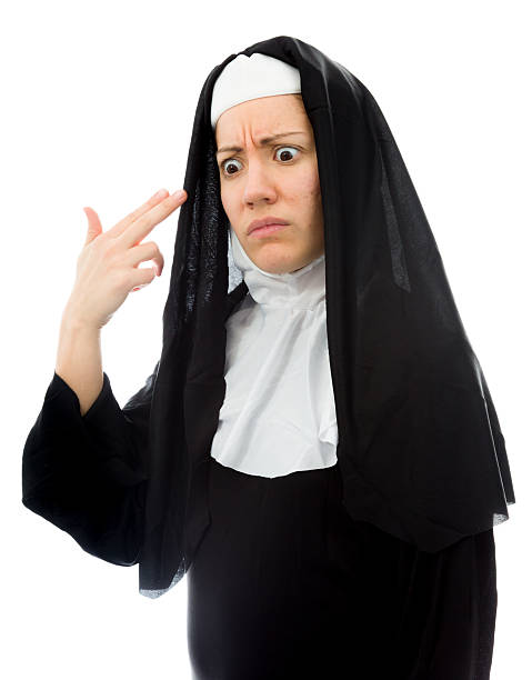 istock Young nun making gun with hand pointed at head 494959667