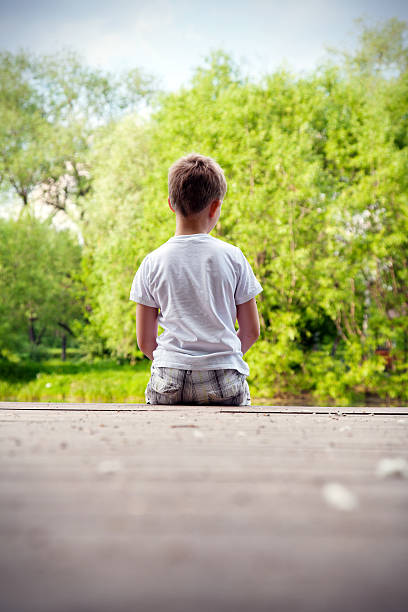 istock portrait of a boy in the forest 494960429