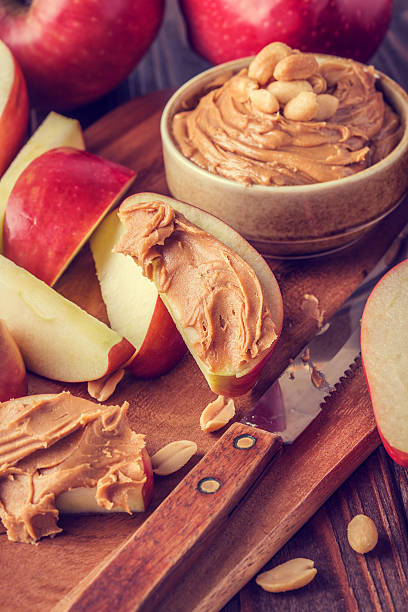 istock Red apples and peanut butter for snack 494960566