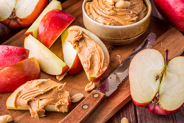 istock Red apples and peanut butter for snack 494960606
