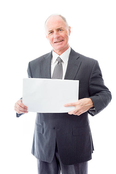 istock Businessman holding a blank placard and smiling 494960999