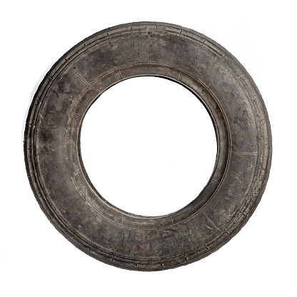 Small dirty old tire isolated over white