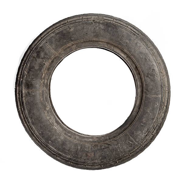 Small old dirty tire isolated stock photo