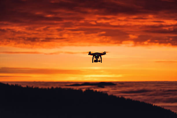 istock Personal drone flying through the air at sunrise 494972412