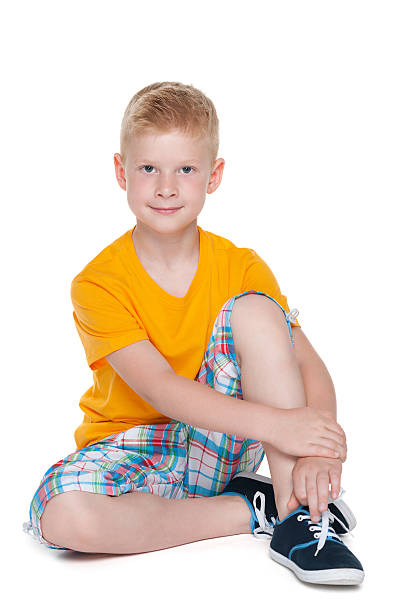 istock Smiling little boy in the yellow shirt 494973526