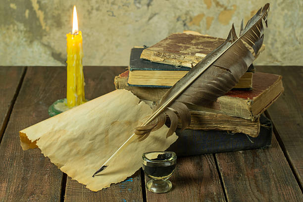 istock Old books, candle and feather with inks 494974278
